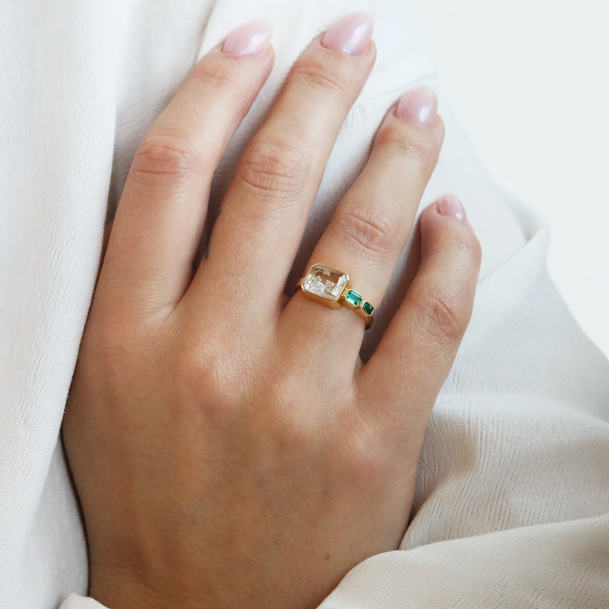 Gold Ring with Diamond Shake and Emerald Baguette Details